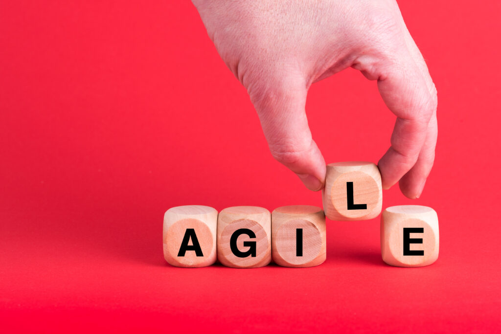 Custom Shopify Themes: Unlocking Complexity and Growth Opportunities 1 closeup of someone arranging dices to read agile 2023 11 27 05 22 58 utc